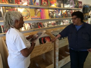 Necia talks with Marion about records.